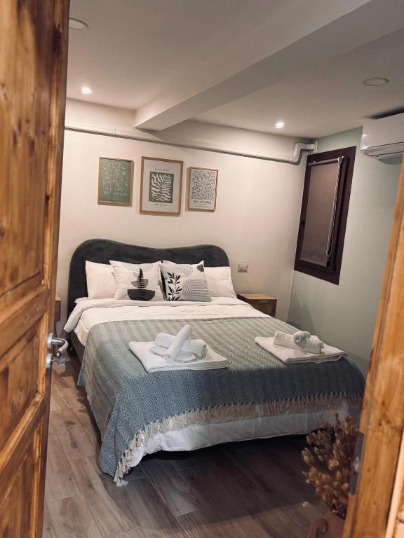 a bedroom with a bed with two towels on it at B&B Note di Verdi in Parma