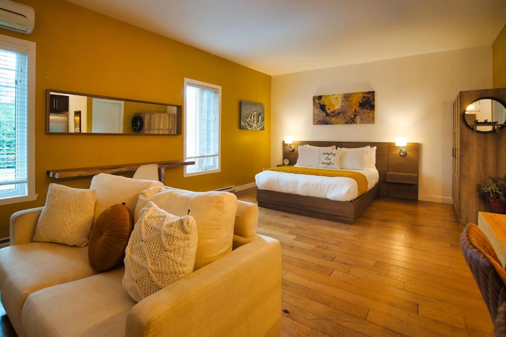 Ένα ή περισσότερα κρεβάτια σε δωμάτιο στο Condo Hôtel Magog Orford