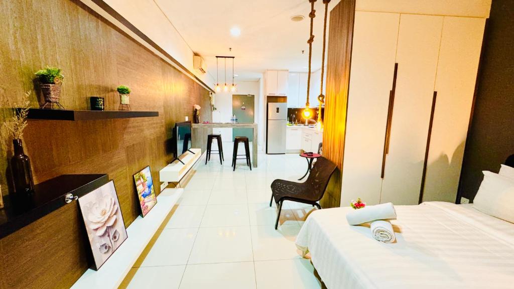 Postel nebo postele na pokoji v ubytování Mercu Summer Suites by SUN