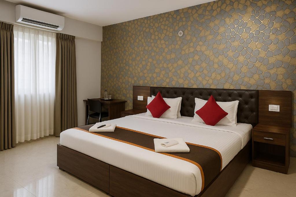 Postel nebo postele na pokoji v ubytování Sai Bliss International, Manyata Tech Park