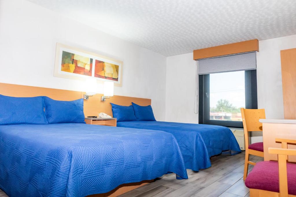 Postel nebo postele na pokoji v ubytování Hotel Galerías Express