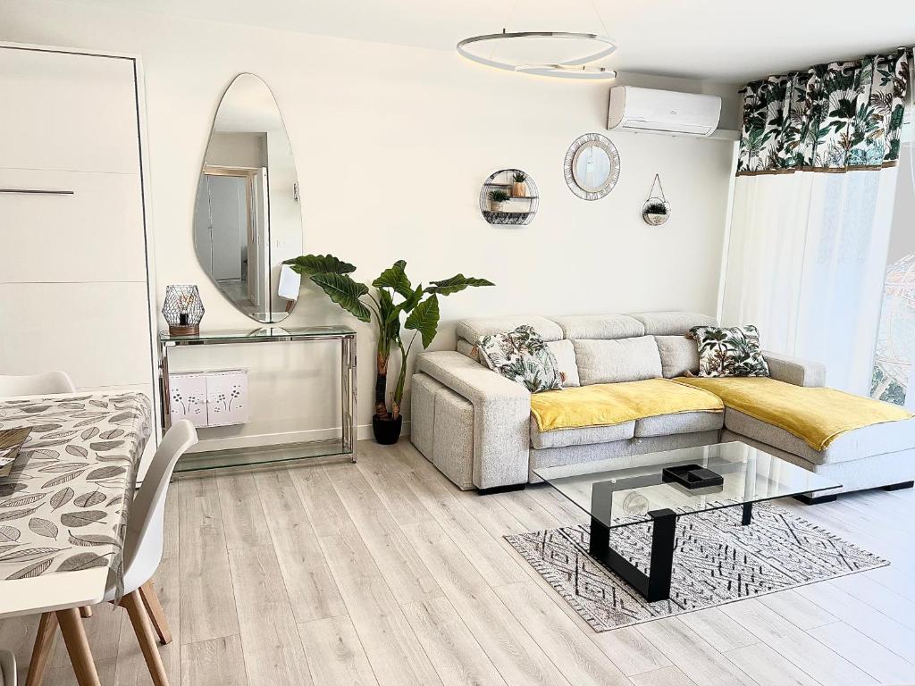 a living room with a couch and a table at Paradistay in Cannes