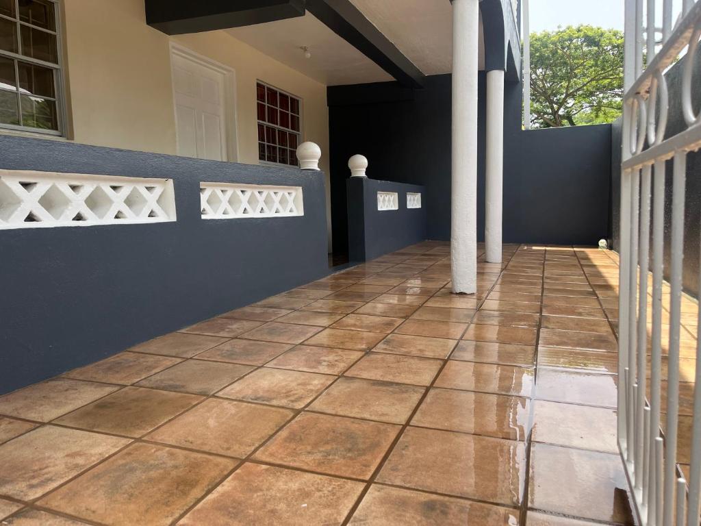 a hallway of a house with a tile floor at Mountain View Apartments in Gros Islet