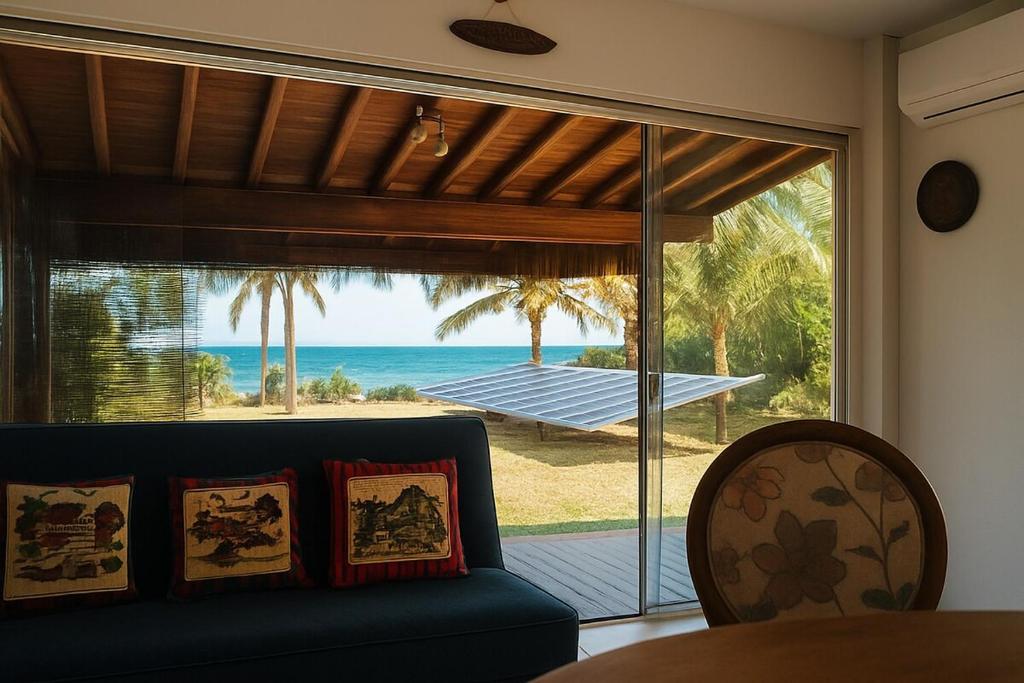 a living room with a couch and a view of the ocean at Casa da Prosperidade in Marau