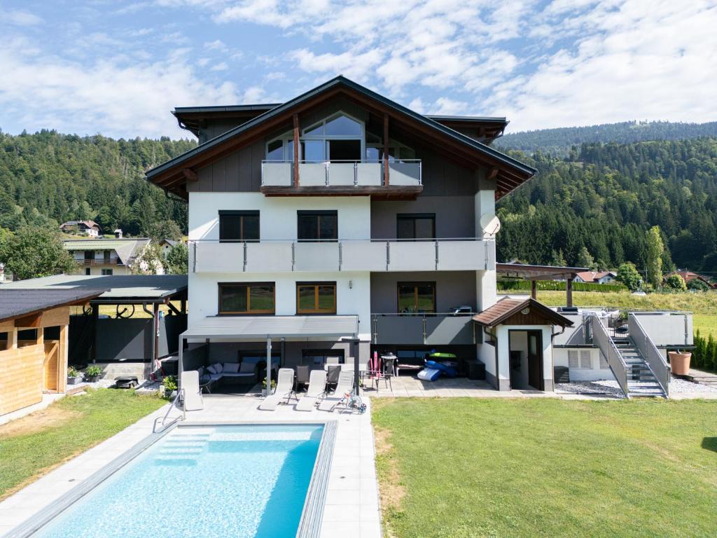 a house with a swimming pool in front of it at Nico's Place in Jenig