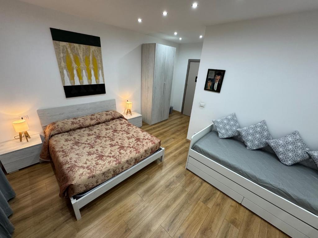 Postel nebo postele na pokoji v ubytování Aria di Casa Experience