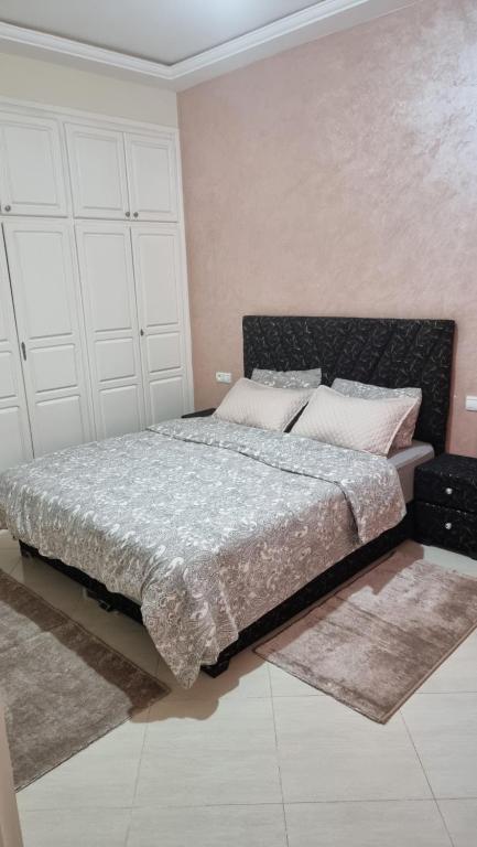 Ένα ή περισσότερα κρεβάτια σε δωμάτιο στο appartement luxe