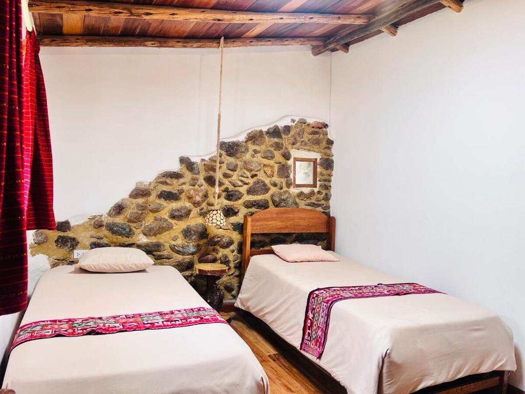 Postel nebo postele na pokoji v ubytování Stone house in Ollantaytambo