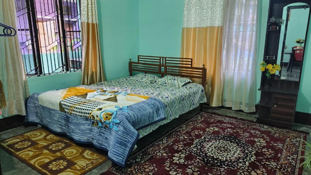 Ένα ή περισσότερα κρεβάτια σε δωμάτιο στο Mitali Homestay