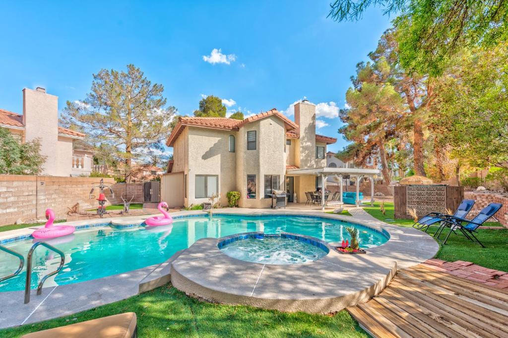 a swimming pool in the yard of a house at Vila Sol in Las Vegas