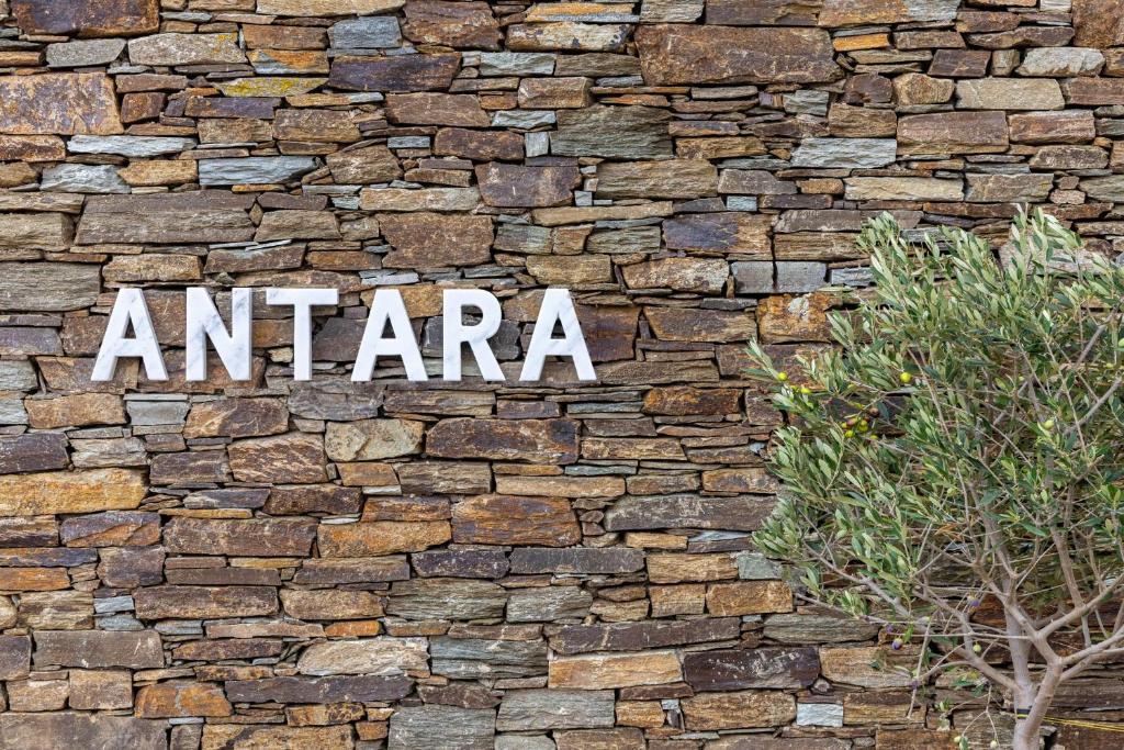 a stone wall with the word antara written on it at Antara in Stení