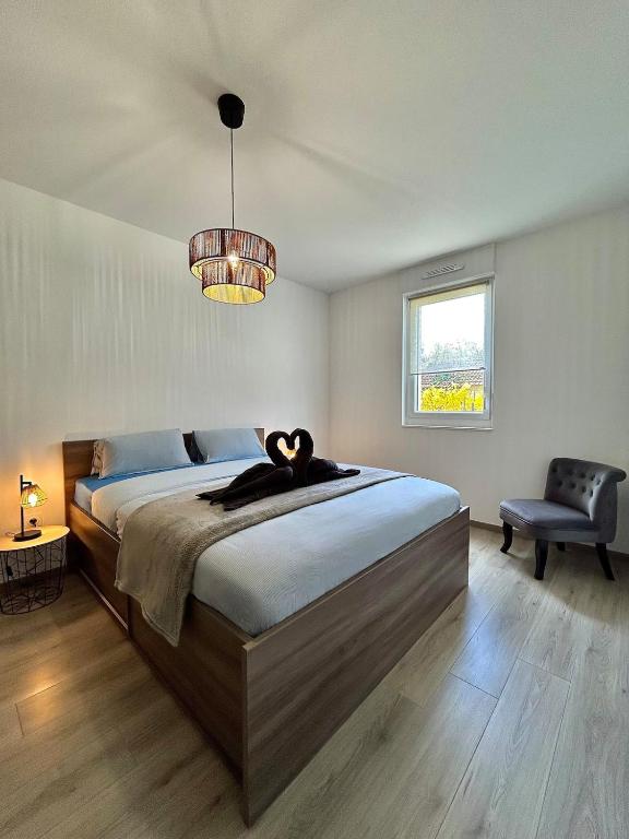 En eller flere senge i et værelse på Appartement moderne - Sur le sentier des vignes