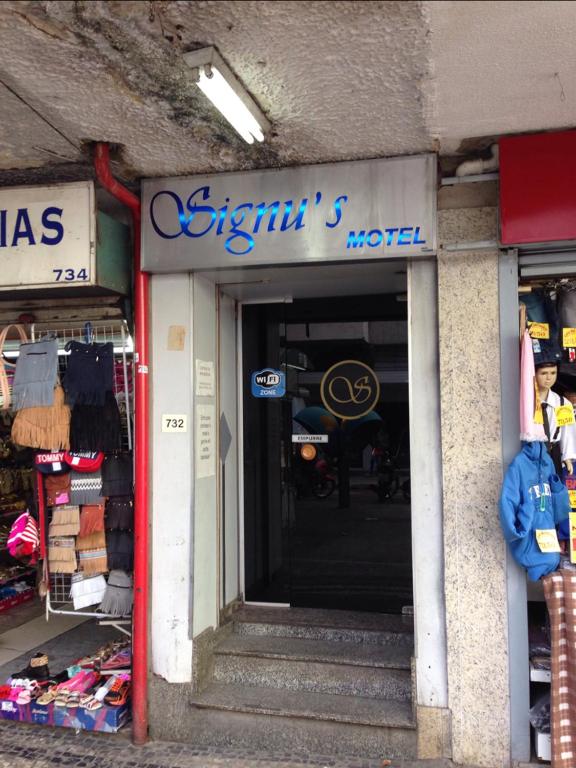 a store front of a store with the door open at Signus 2 in Belo Horizonte