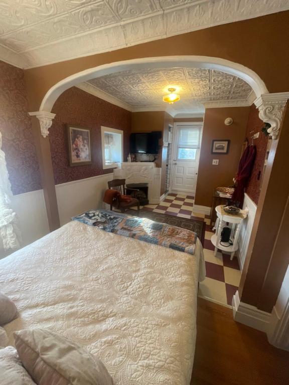 a bedroom with a large bed in a room at Wakamow Heights Bed and Breakfast in Moose Jaw