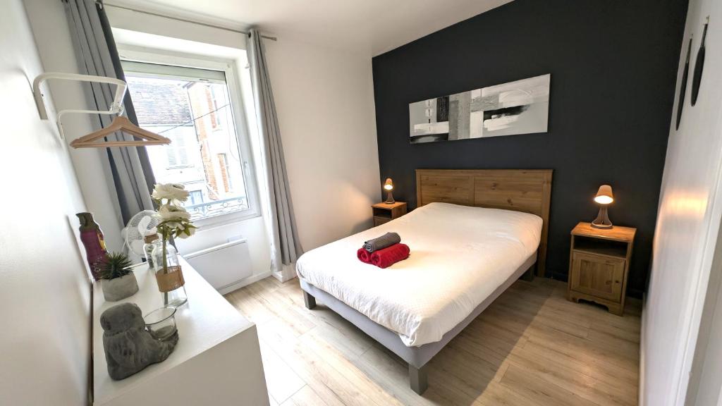 Ένα ή περισσότερα κρεβάτια σε δωμάτιο στο Le cosy nest