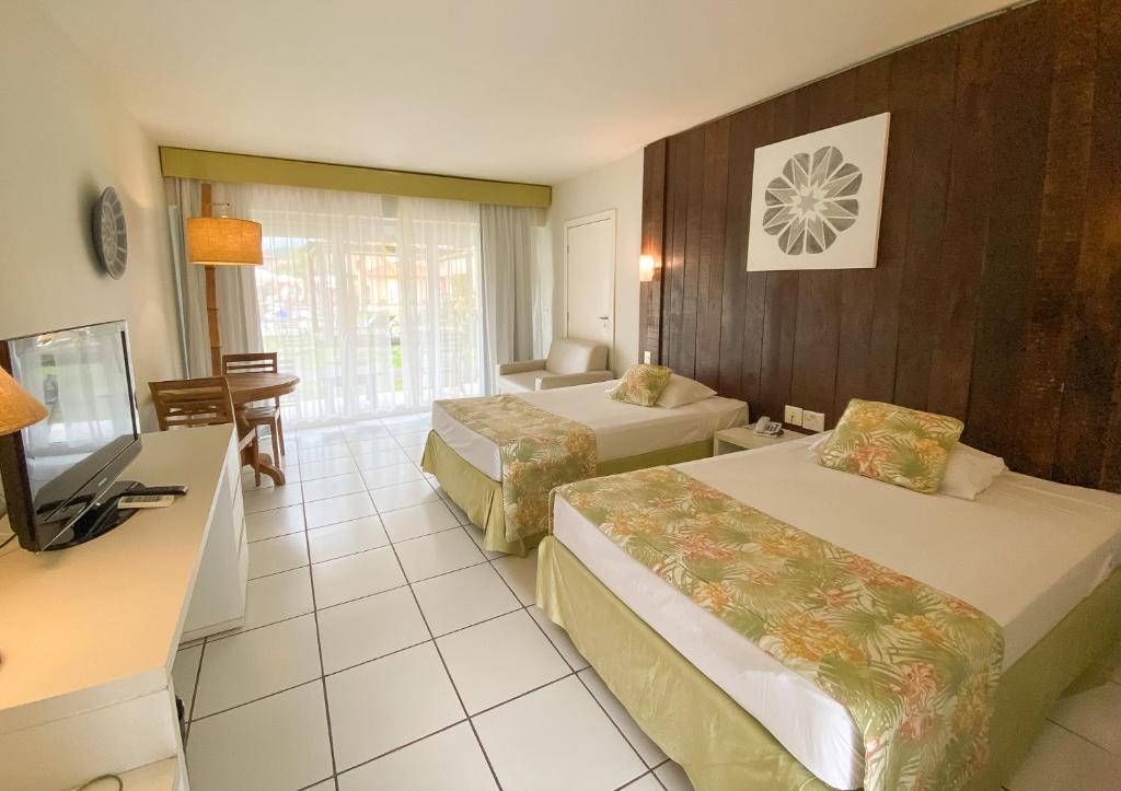 Postel nebo postele na pokoji v ubytování Búzios Beach Resort