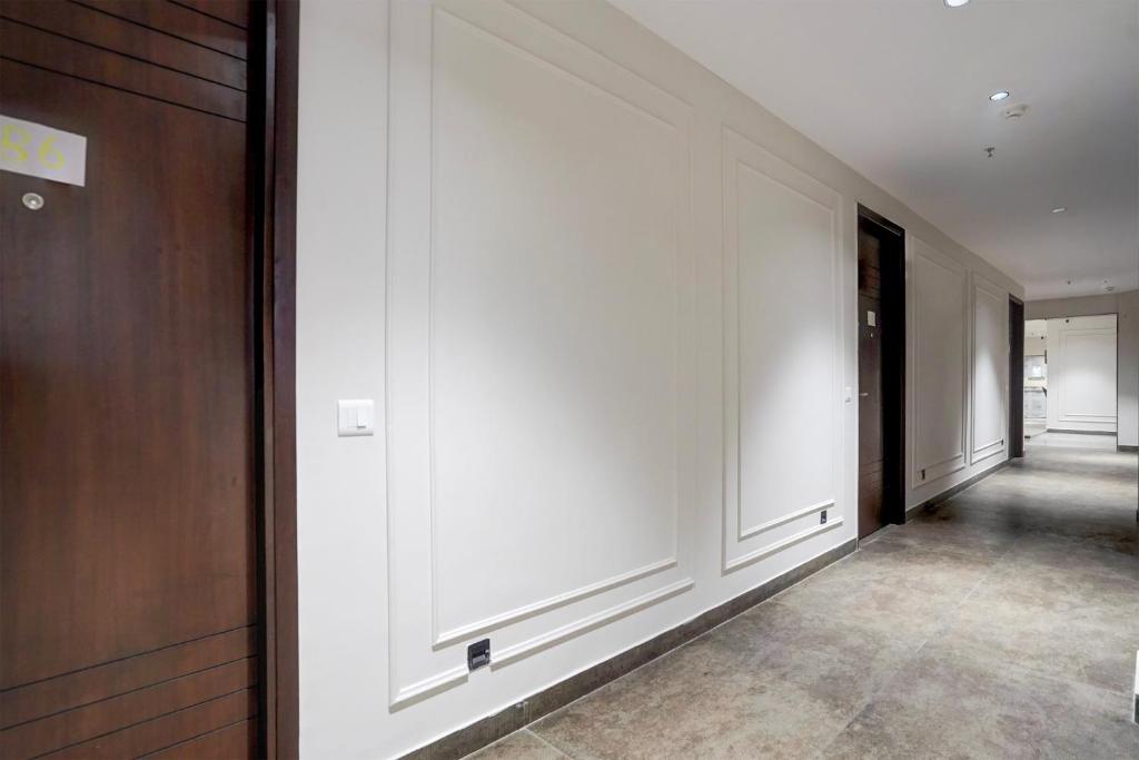 Postel nebo postele na pokoji v ubytování HOTEL O ELVILLA