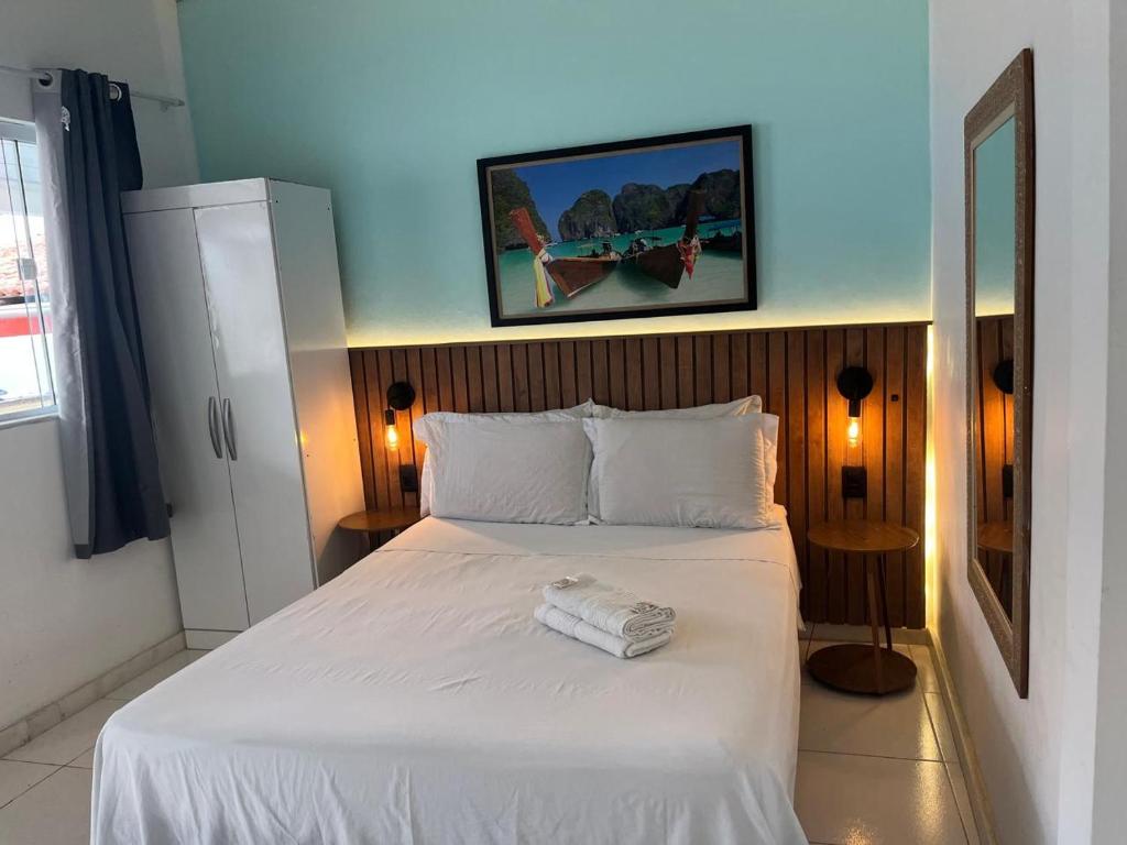 Postel nebo postele na pokoji v ubytování Nascimento Suites