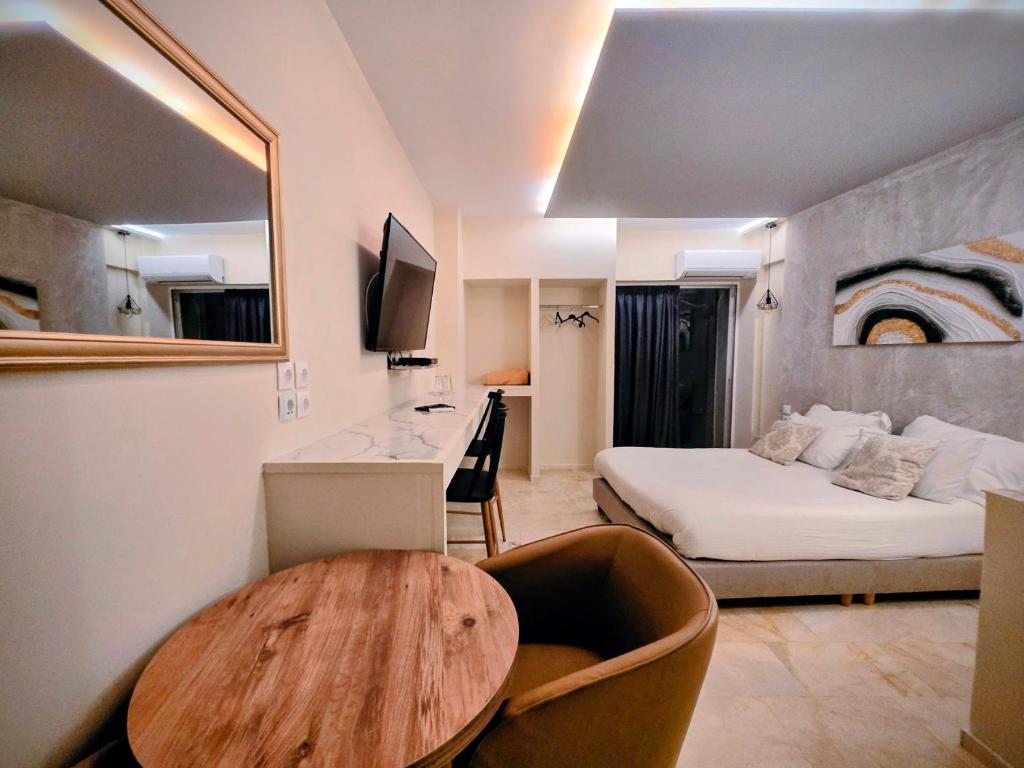 a room with a bed and a table in a room at CENTRAL VIEW ΜΙΔΕΙΑ in Levádeia