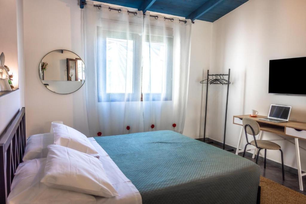 Ένα ή περισσότερα κρεβάτια σε δωμάτιο στο NellaRiserva25-Vurria