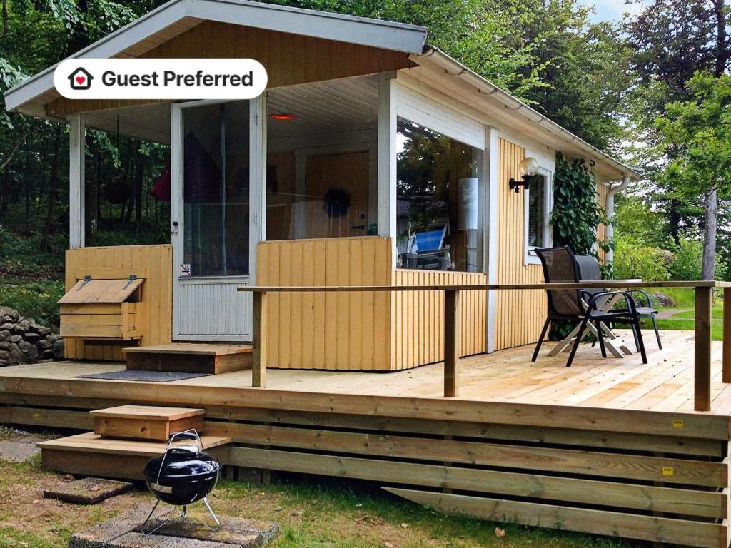 a house with a guest preferred sign on a deck at 2 person holiday home in TYRINGE-By Traum in Tyringe