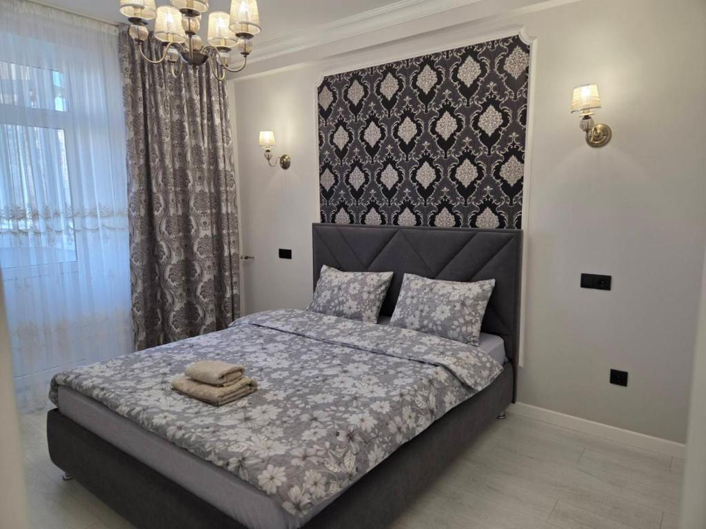 Ένα ή περισσότερα κρεβάτια σε δωμάτιο στο Транзит Сервис 1 Аэропорт- Кишинёв