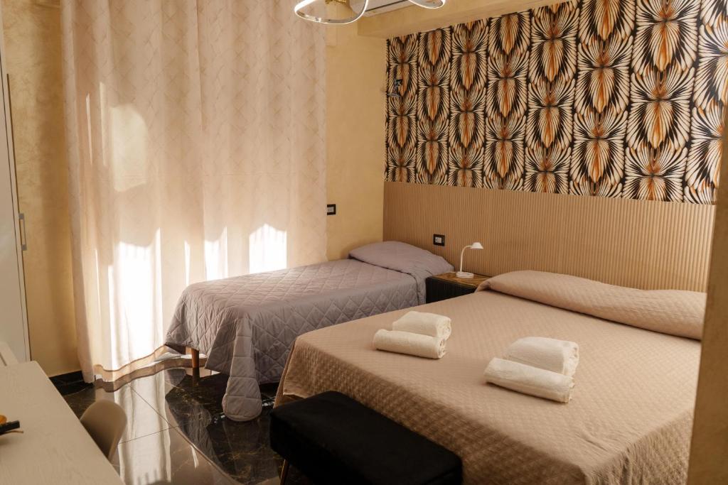 Giường trong phòng chung tại BeB Imperial