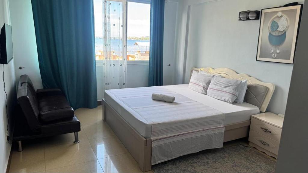 Ένα ή περισσότερα κρεβάτια σε δωμάτιο στο Masaki H and Apartment