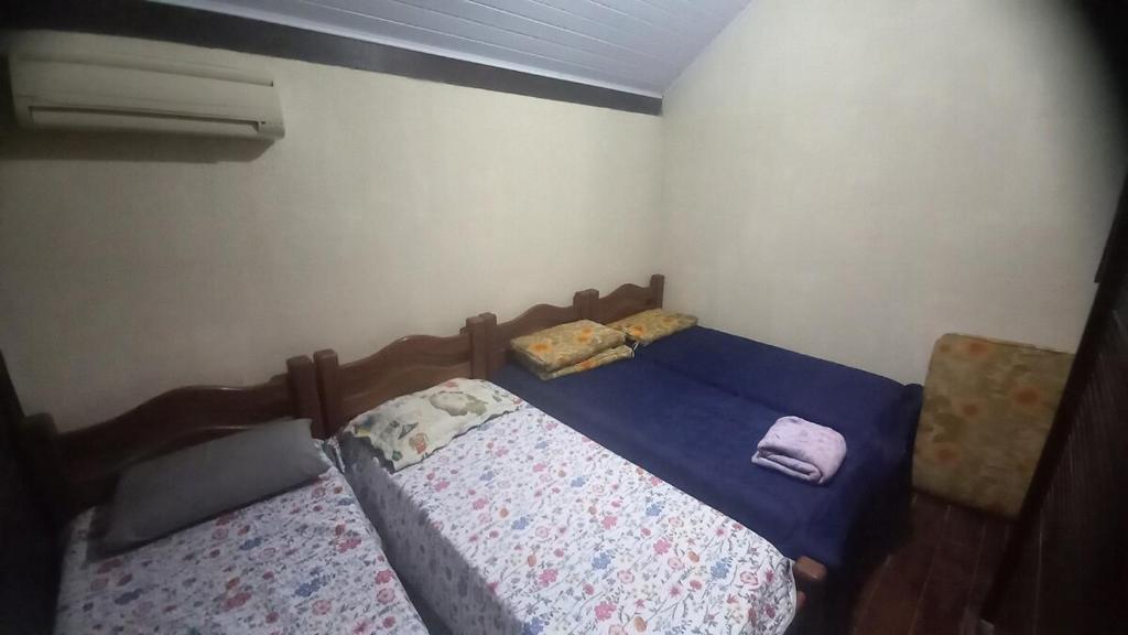 En eller flere senge i et værelse på Casa 11 Condomínio Completo 4qts