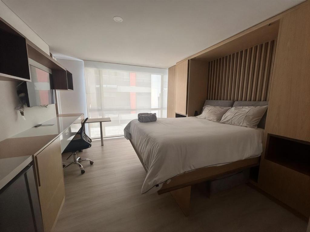 Postel nebo postele na pokoji v ubytování Estudio moderno en Usaquen,check in facil