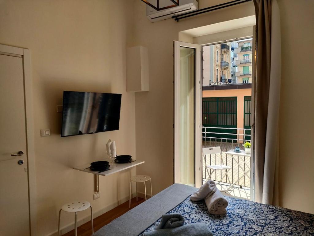 a bedroom with a bed and a window with a view at Noblerot in Turin
