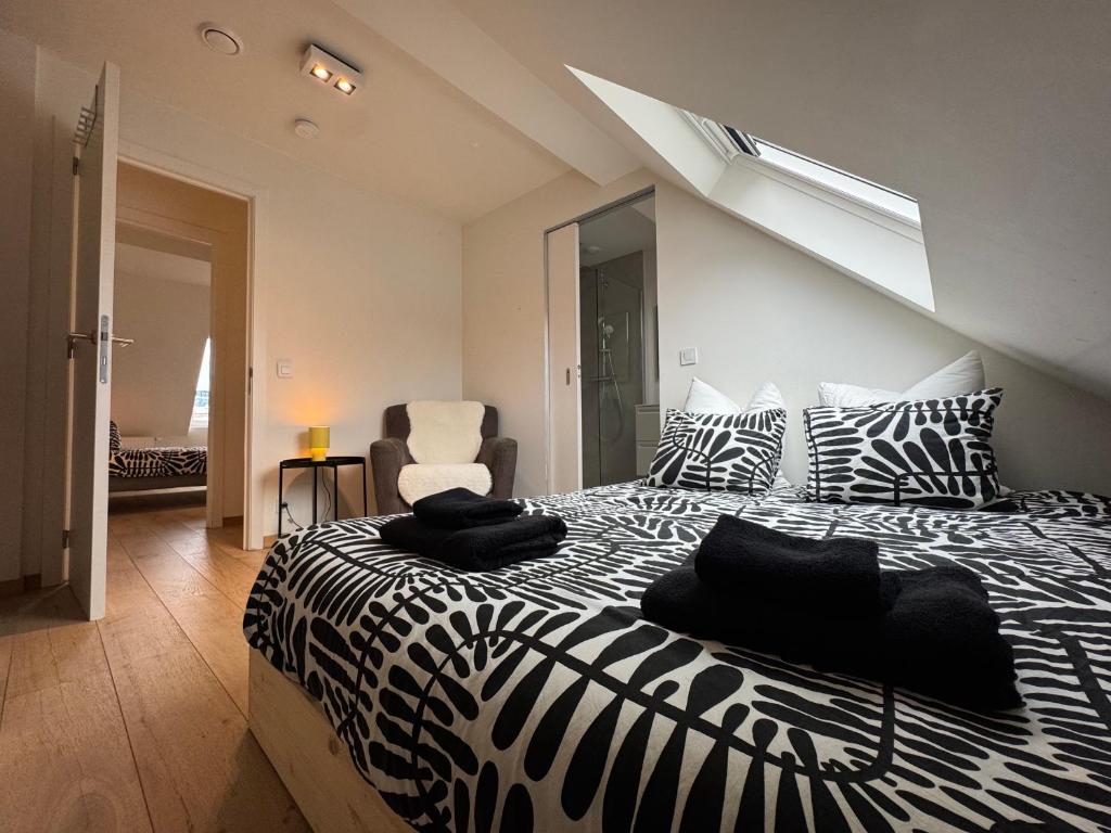 a bedroom with a zebra print bed in a room at Spacious and Design Loft in Brussels