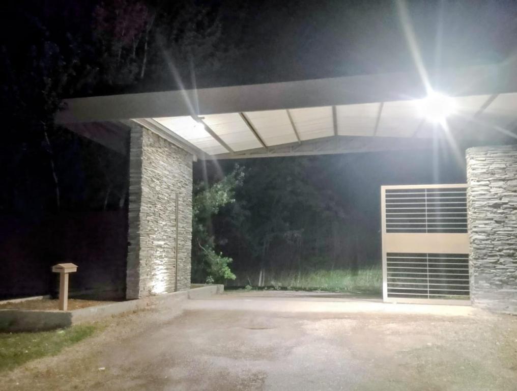 a garage at night with a light on top at Brasa Loft de Campo in Colonia Las Rosas