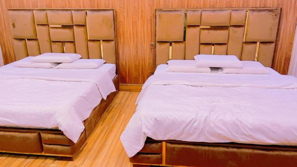 Ένα ή περισσότερα κρεβάτια σε δωμάτιο στο Sapphire Suits & Boutique Hotel