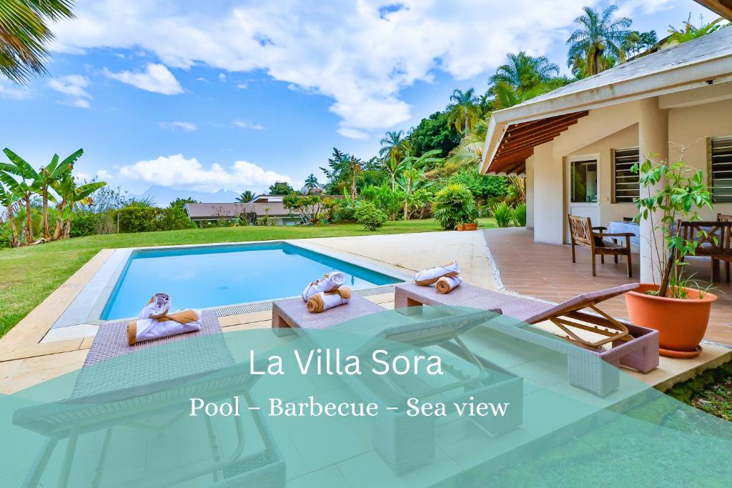 a villa with a swimming pool in a resort at Blue Horizon - La Villa Sora - Pool - Sea view in Punaauia