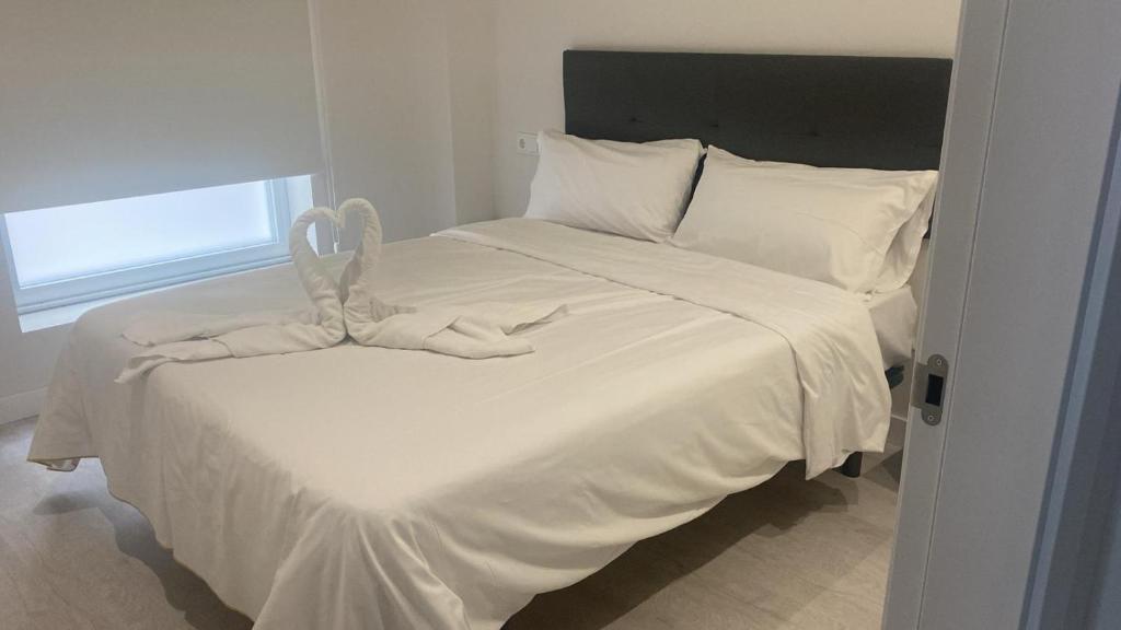 Postel nebo postele na pokoji v ubytování Apartamentos Turísticos Praia dos Crsitais