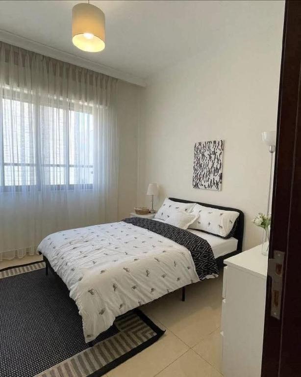 Postel nebo postele na pokoji v ubytování Abo-Khaled Home