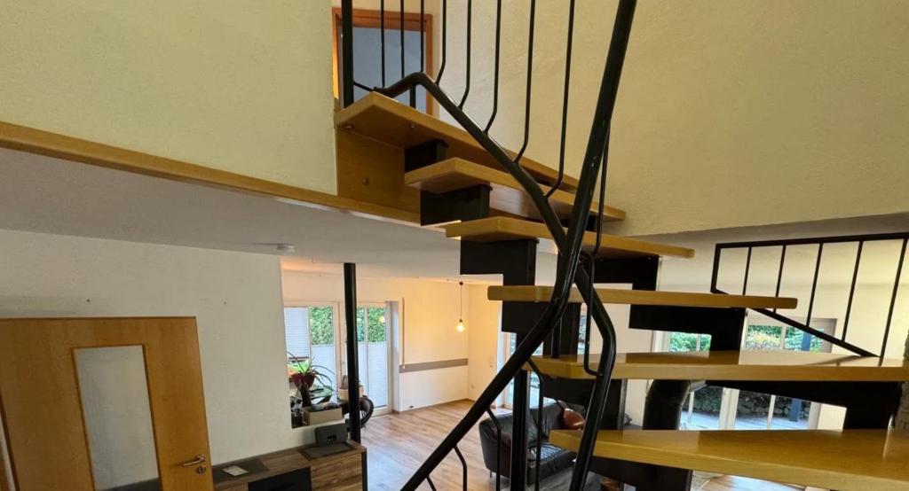 a spiral staircase in a house with at Wohnung Arton in Möhlin