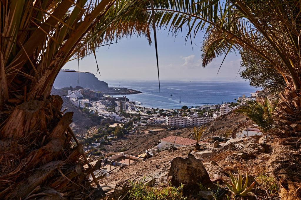 a view of the city of positano and the ocean at CASA TONINO in Mogán