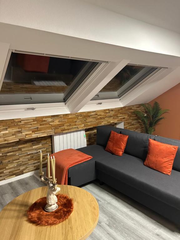 Posezení v ubytování Le Refuge du Cerf