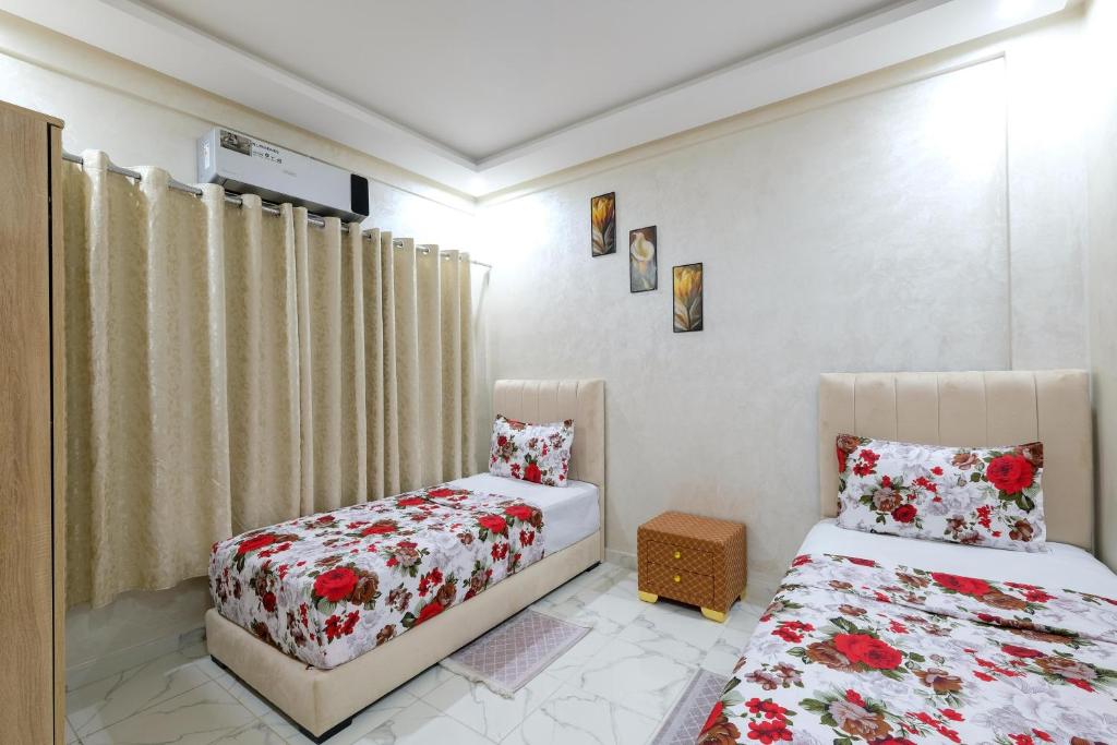 Postel nebo postele na pokoji v ubytování Riad Bollywood- International