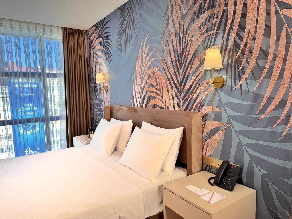 Ένα ή περισσότερα κρεβάτια σε δωμάτιο στο Park Dedeman Sisli