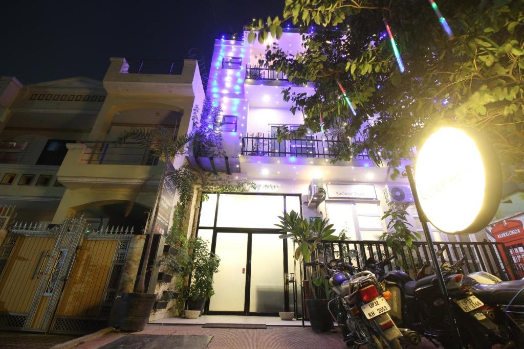 a building with a lit up facade at night at Super Townhouse Kachnar House Vikas Nagar in Lucknow