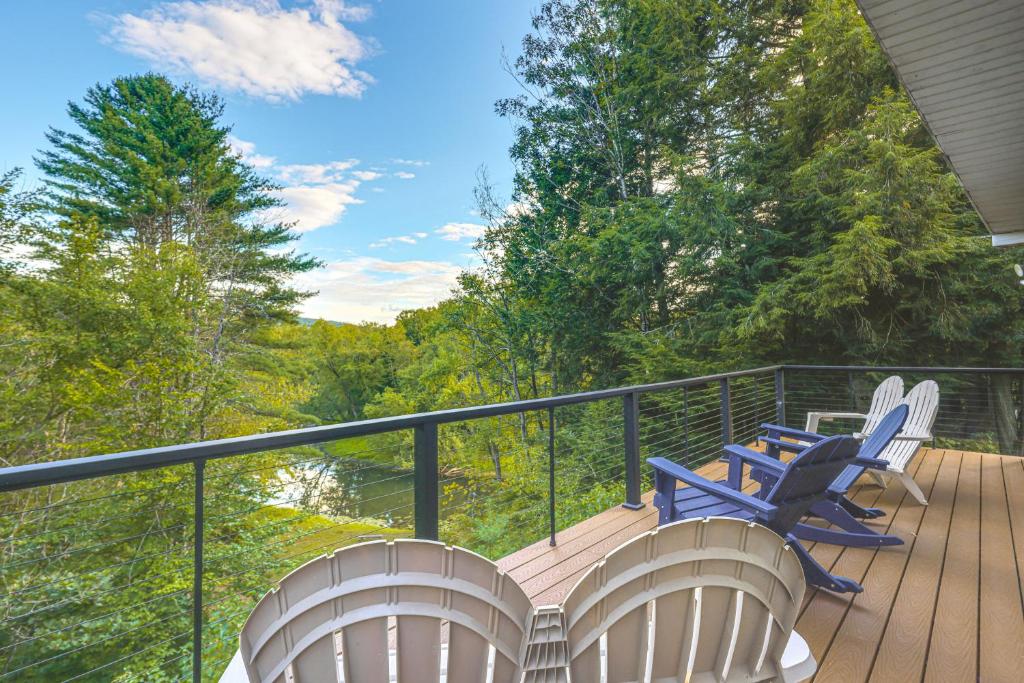 a balcony with chairs and a deck with trees at 9 Mi to Hickory Ski Center Wooded Warrensburg Gem in Bolton