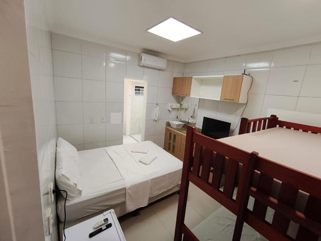 Ένα ή περισσότερα κρεβάτια σε δωμάτιο στο Essenza Suites Natal