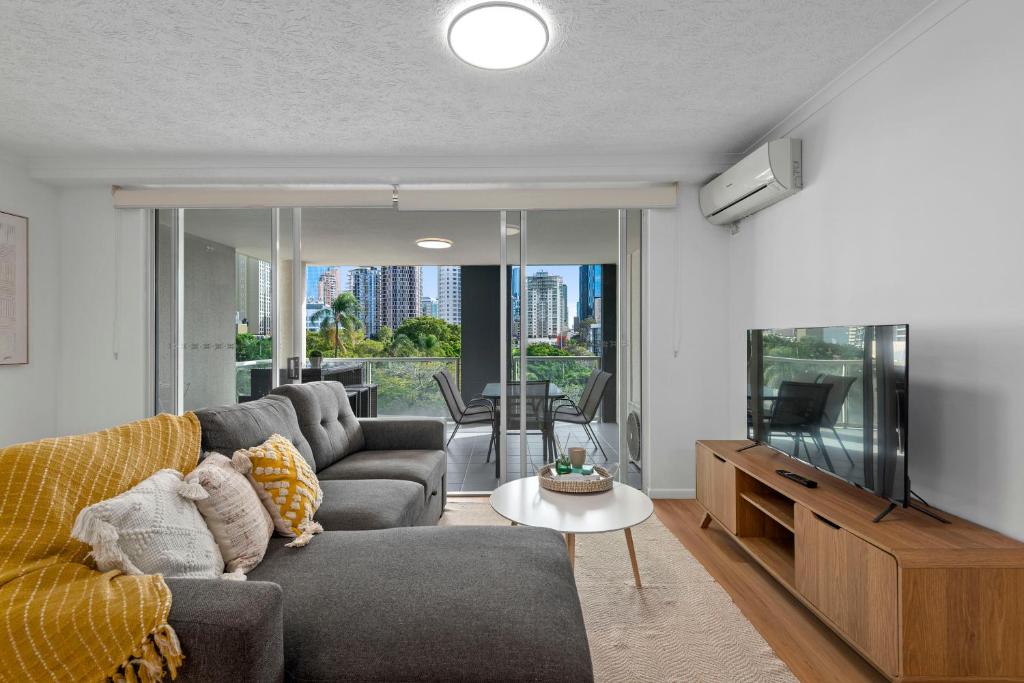 Central 2BR Apt with City Views, Balcony & Car Park