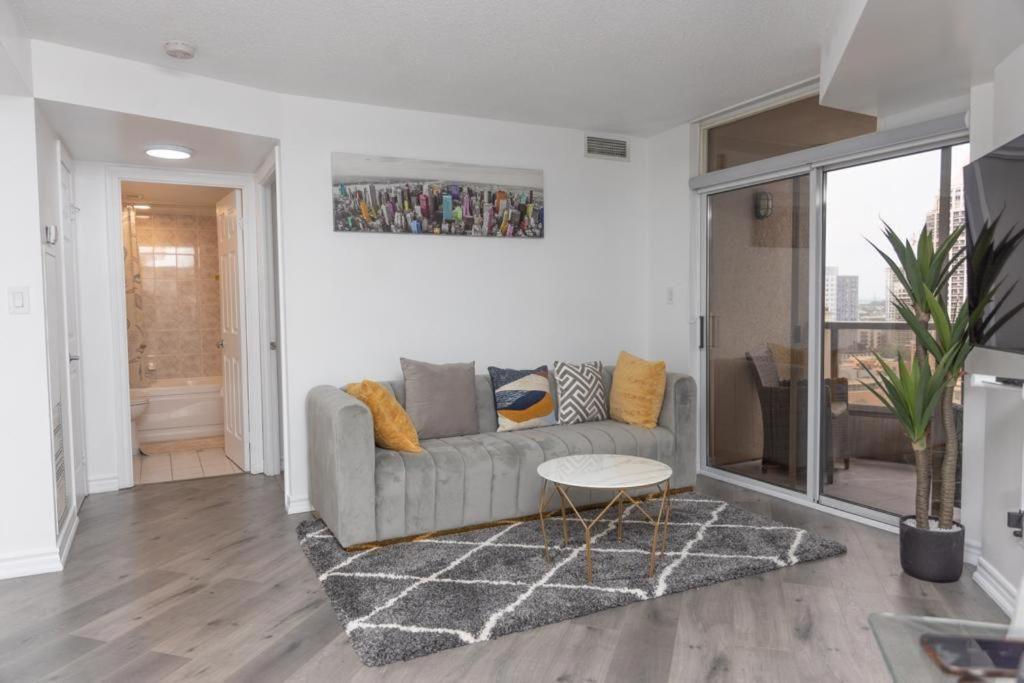 a living room with a couch and a table at PlanURstay - Ideal 2BR & 2 BTH - Near SQ1 Mall in Mississauga