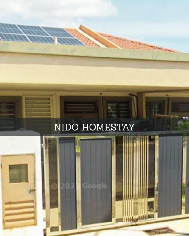 a house with a sign that reads nido homesteadery at PORT DICKSON HomeStay, Family 2 BR Netflix Wifi in Port Dickson