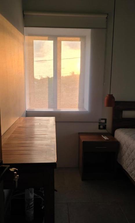 Postel nebo postele na pokoji v ubytování Casa de Las Flores