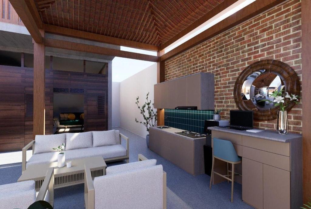 a living room with a couch and a table at Ndalem Argupta in Kalibeber